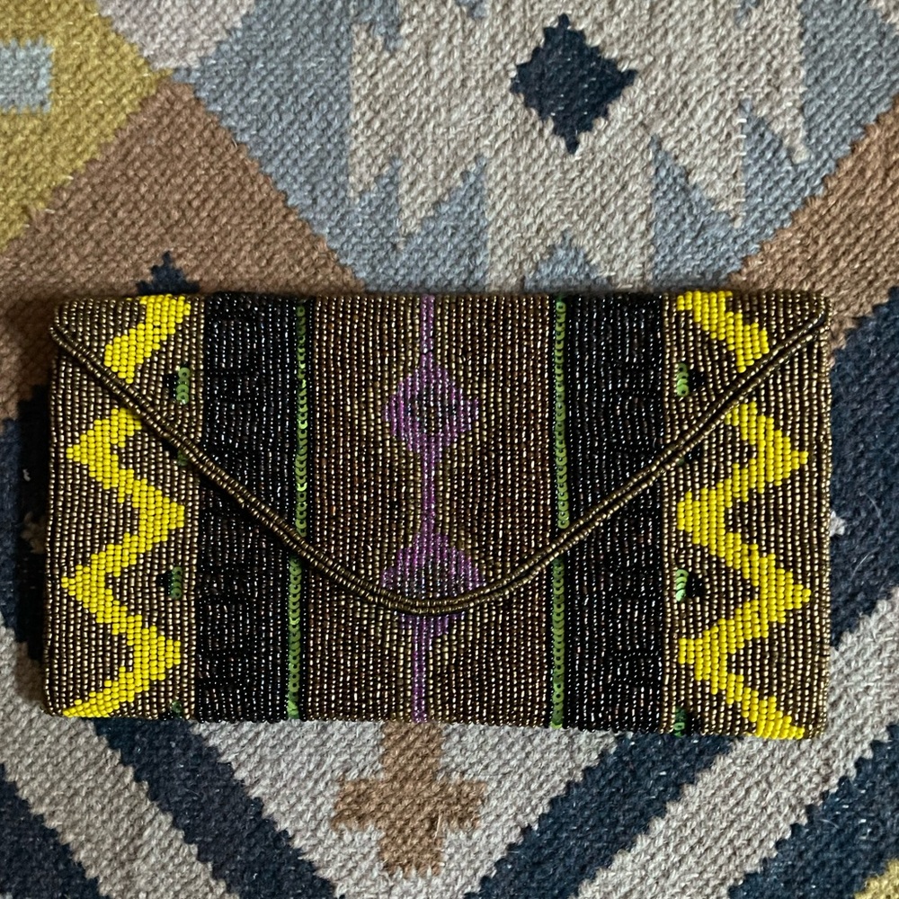 Amazing beaded clutch goes with so many colors -yellow bronze black green purple